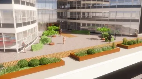 Een modern stadsplein bij het Stationspark met plantenbakken, bomen en mensen die rondlopen.