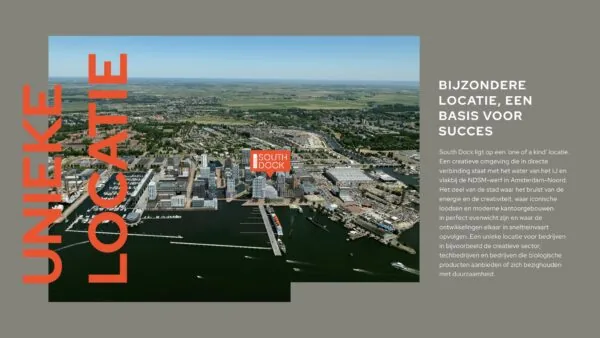 Luchtfoto van de NDSM-werf in Amsterdam-Noord met het gebied South Dock gemarkeerd als unieke locatie voor creatieve en duurzame bedrijvigheid.