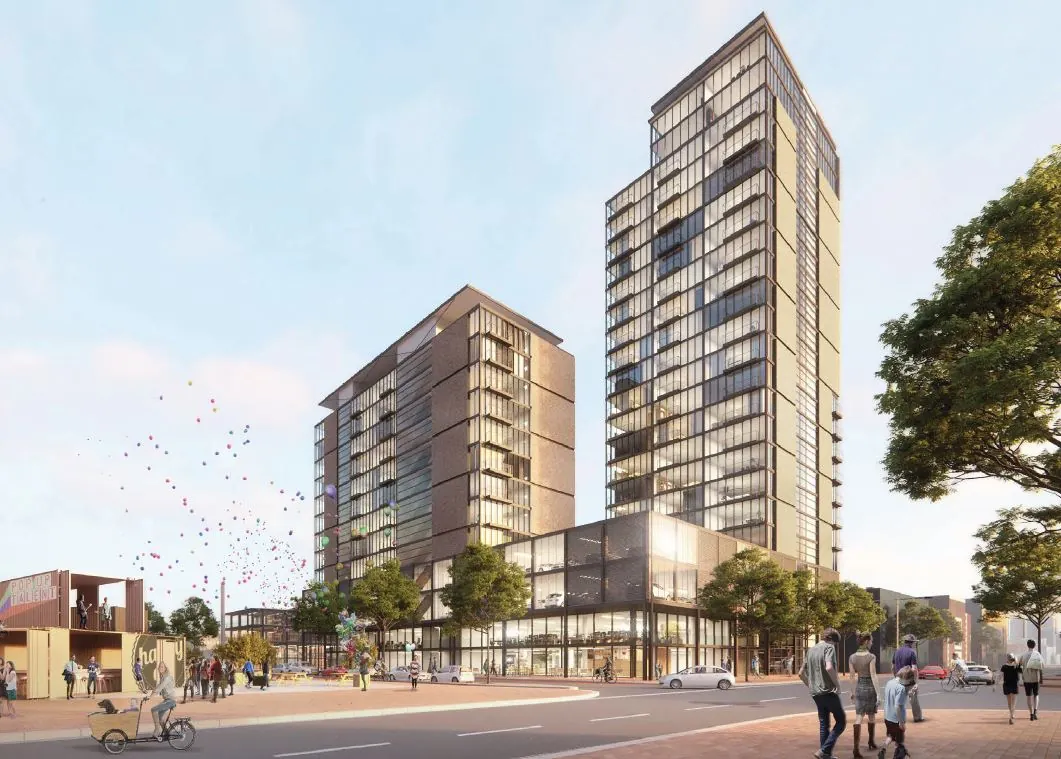 Moderne hoogbouw aan de Melkwegstraat met glazen gevels, omringd door voetgangers, bomen en kleurrijke ballonnen in de lucht.