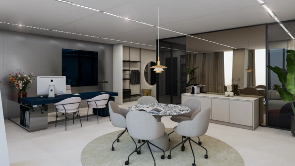 Modern ingerichte kantoorruimte aan de Strawinskylaan met een werkplek, vergadertafel en strakke designmeubels.