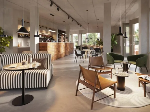 Modern café interior on Zaanstraat featuring stylish seating areas, a wooden bar, and large windows letting in natural light.