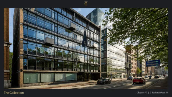 Modern kantoorgebouw aan de Stadhouderskade 85 in Amsterdam met glazen gevel en vlag van The Collection.