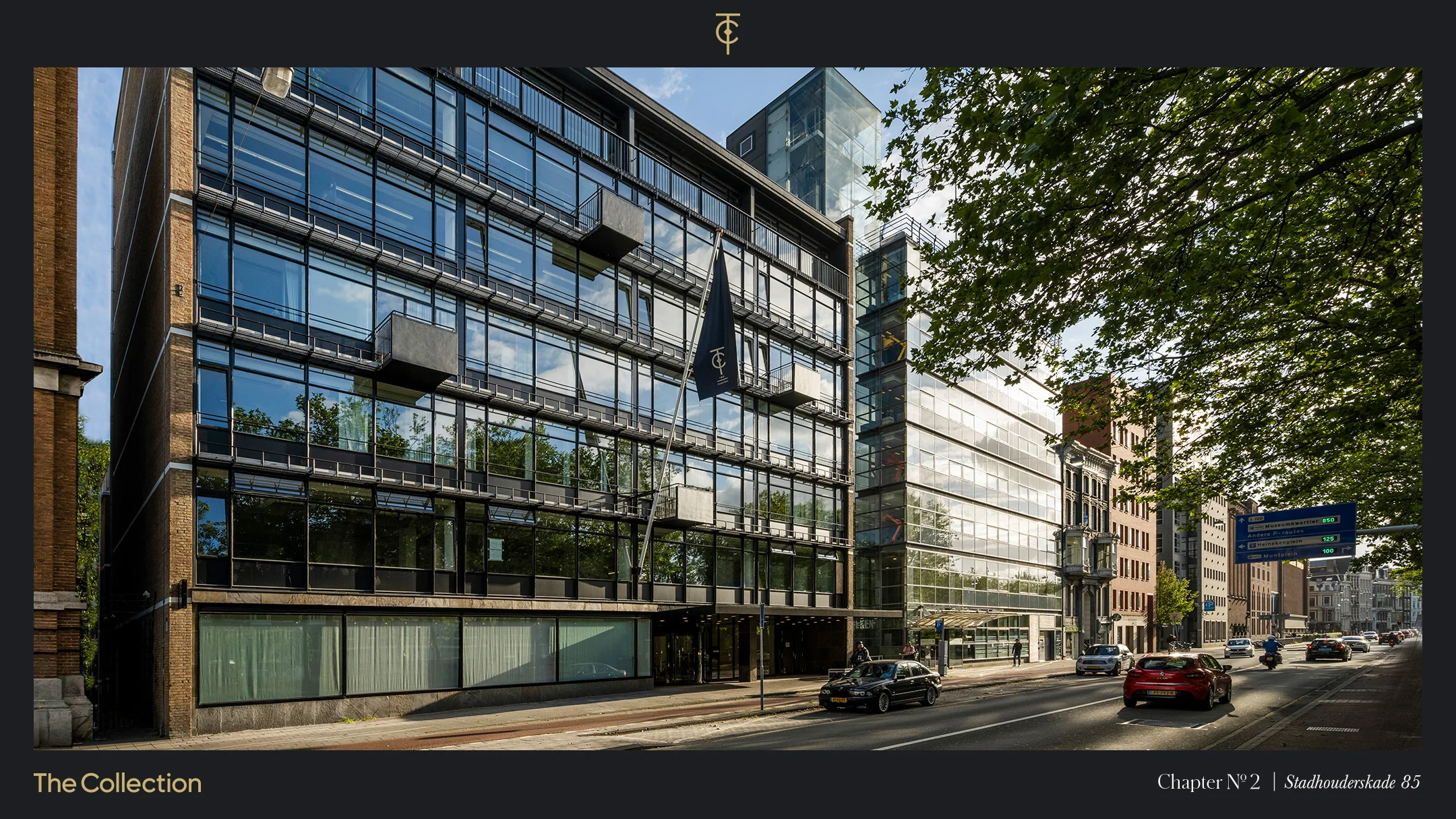 Modern kantoorgebouw aan de Stadhouderskade 85 in Amsterdam met glazen gevel en vlag van The Collection.