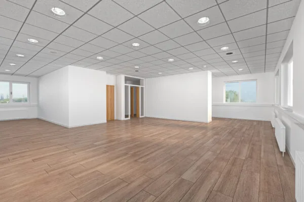 Licht en ruim leeg kantoorpand aan de Laan van S-Gravenmade met houten vloer en systeemplafond.