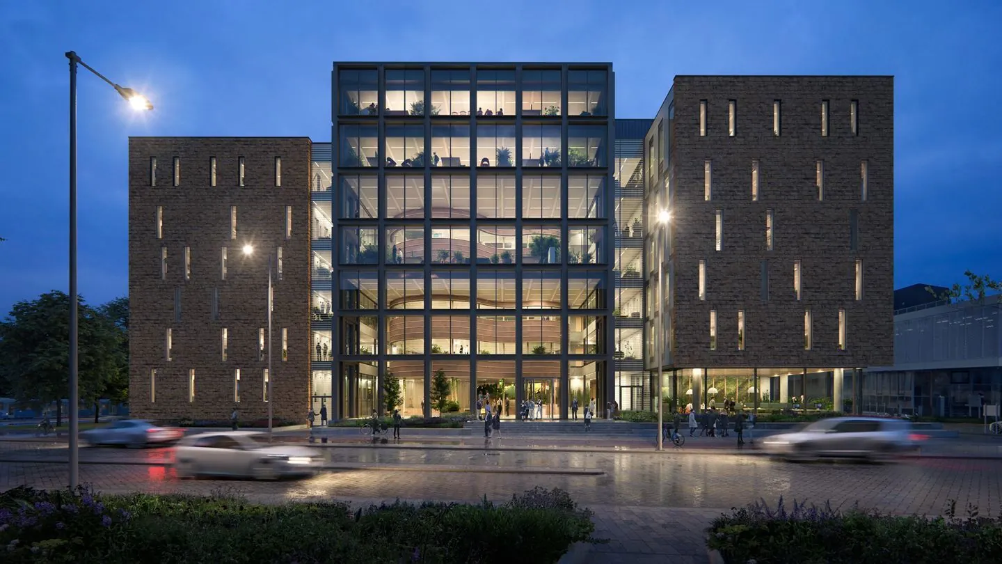 Modern kantoorgebouw aan de Fred. Roeskestraat 100 in Amsterdam, 's avonds sfeervol verlicht.