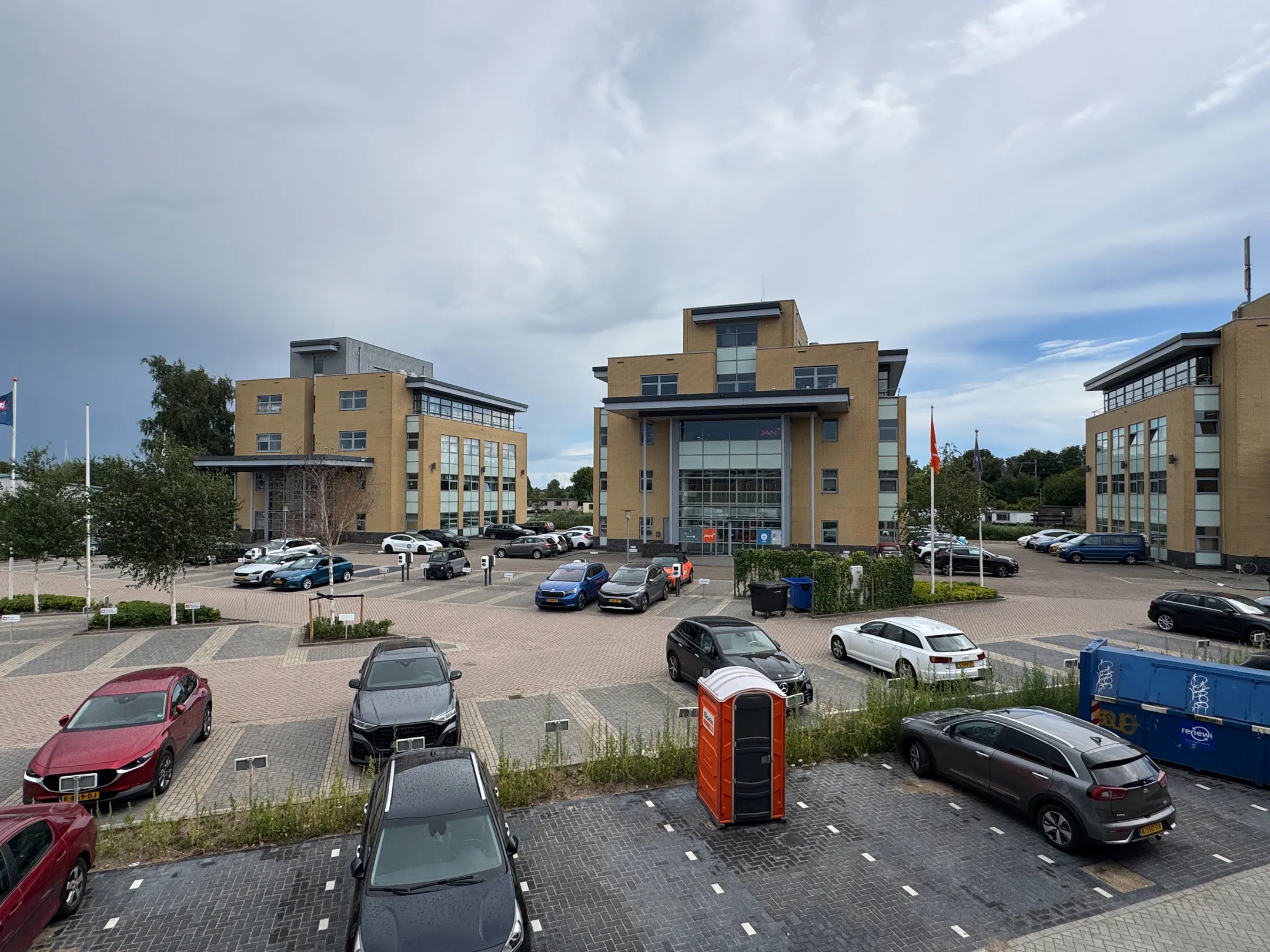 Modern office buildings with parking spaces at Nijverheidslaan 10 in Weesp, Netherlands.
