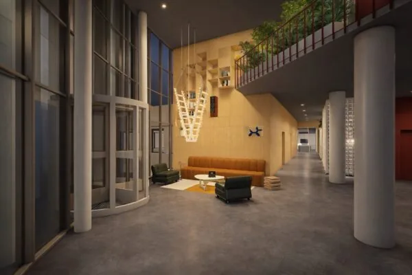 Moderne lobby met hoge plafonds, een ronde draaideur, een zitgedeelte met designmeubels en een hangende houten boekenkast.