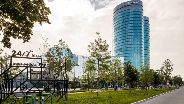 Modern high-rise buildings in Utrecht Zuidwest with Rabobank headquarters and a 24/7 kiosk installation in the foreground.